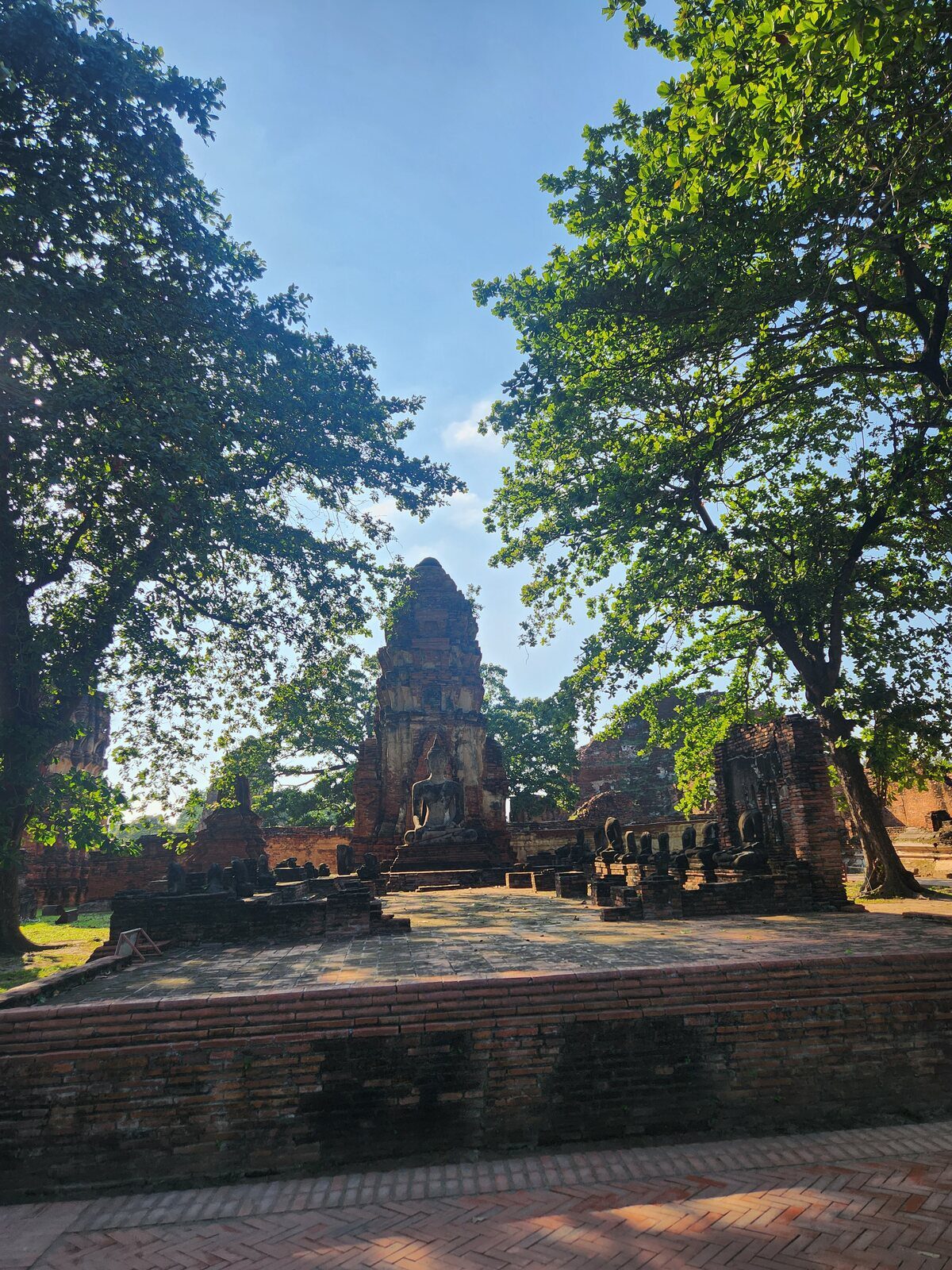 The ruins of Wat Mahathat in Ayutthaya and the Buddha head in tree roots