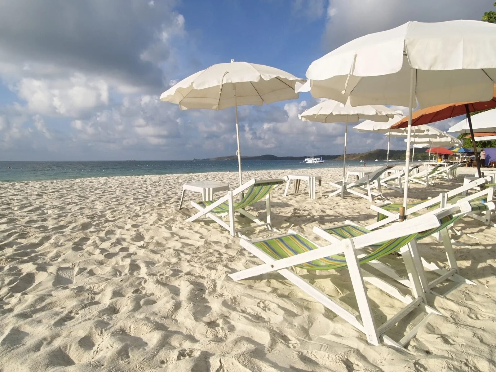 White sand beach on Koh Samet with parasols and loungers