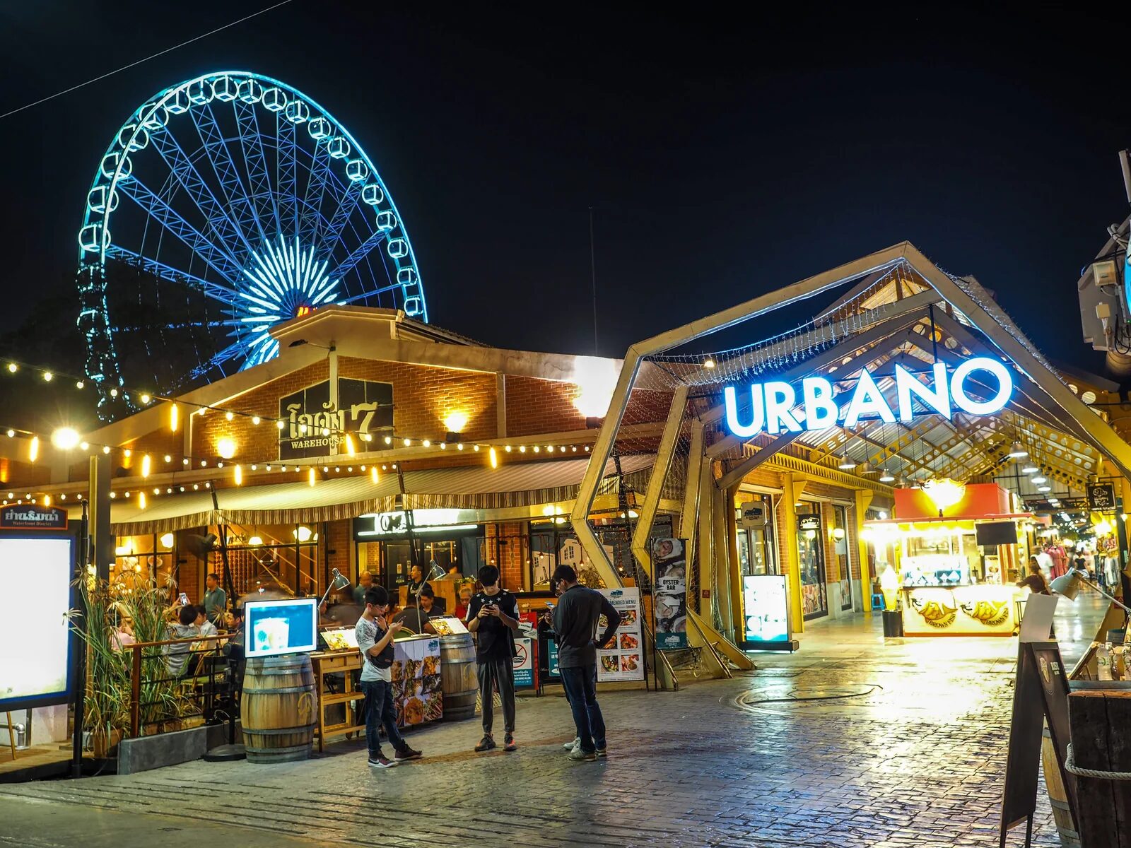 The entrance and evening stalls of JODD FAIRS night market in Bangkok