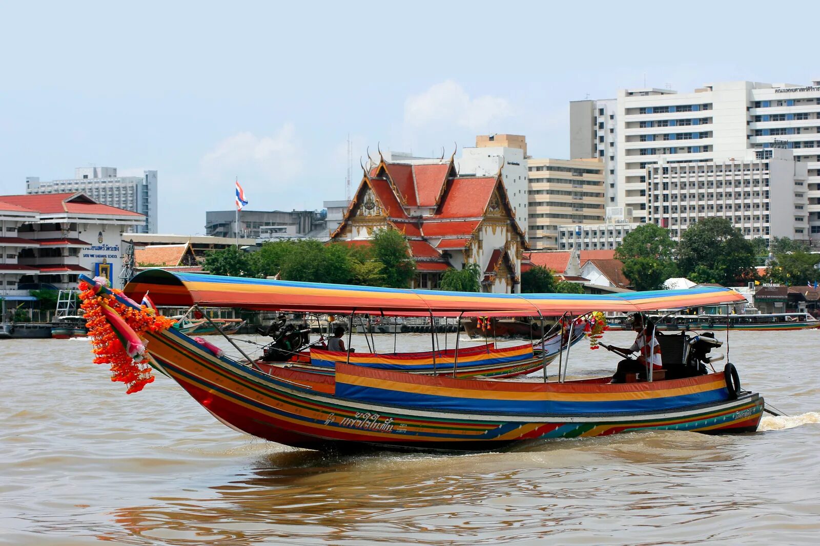 Colourful long-tail boats on the Chao Phraya River in Bangkok