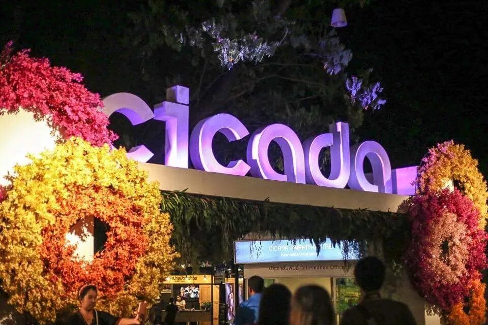 The illuminated night-time entrance of the Cicada Market in Hua Hin