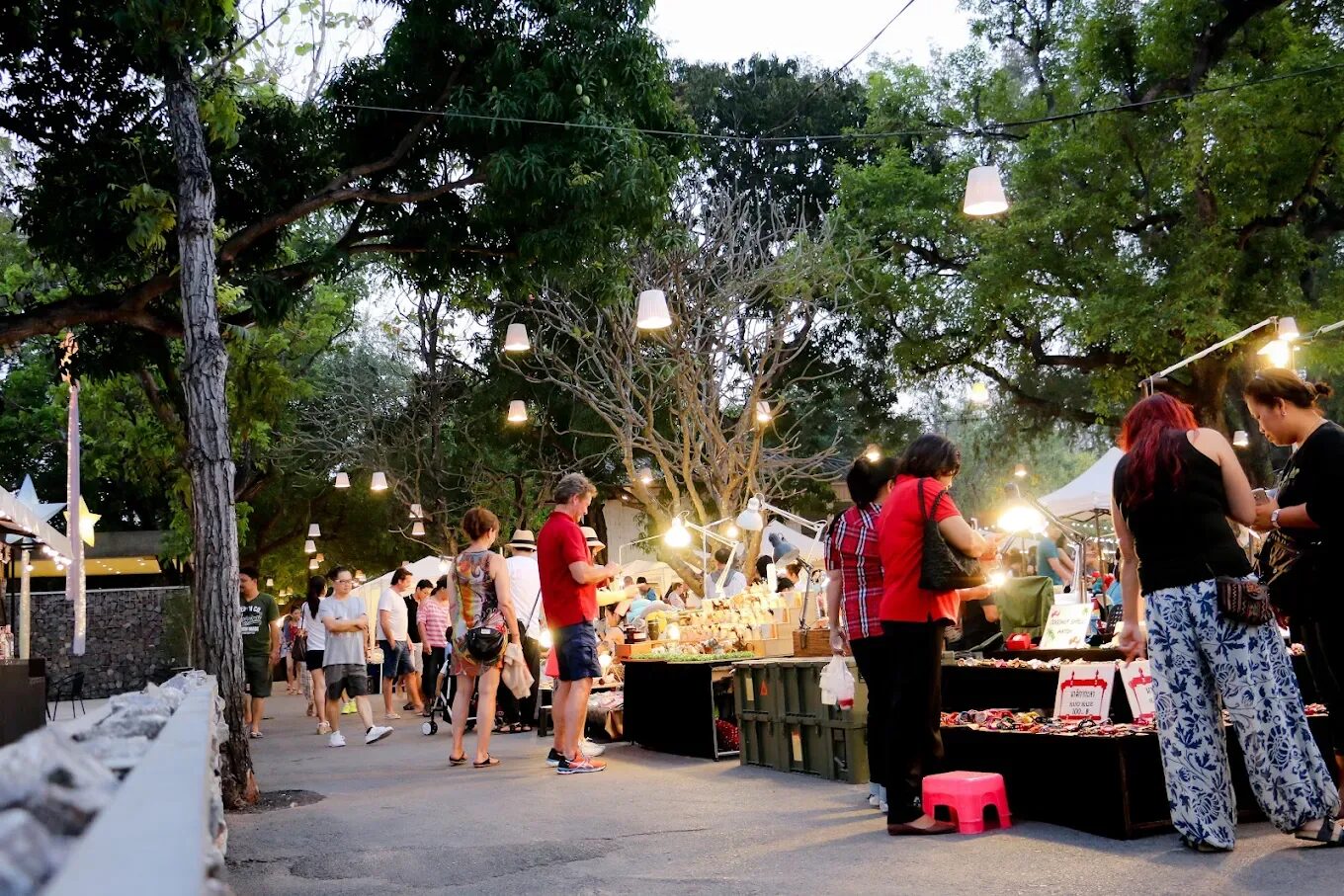 The tree-lined walkway and craft stalls of the Cicada Market in Hua Hin