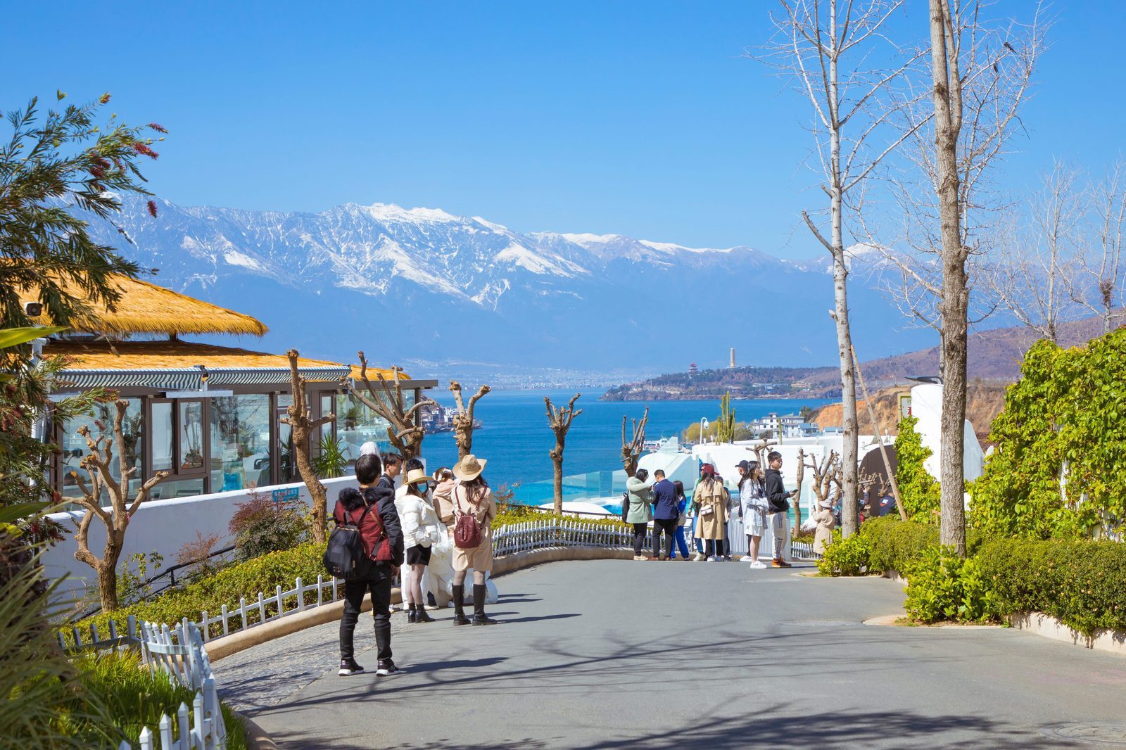White-walled slopes of Lixiangbang, Erhai Lake and snow-capped Cangshan Mountain in Dali
