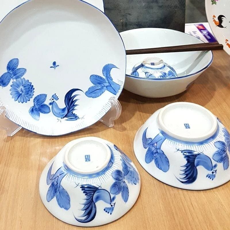 Hand-painted rooster bowls at the Dhanabadee Ceramic Museum in Lampang