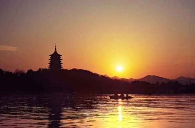 Silhouette of Leifeng Pagoda over West Lake at sunset