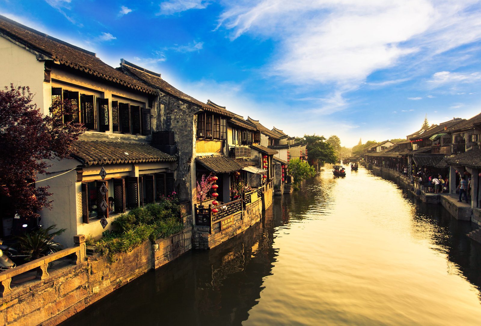 The Shantang River at dusk with riverside houses hung with red lanterns