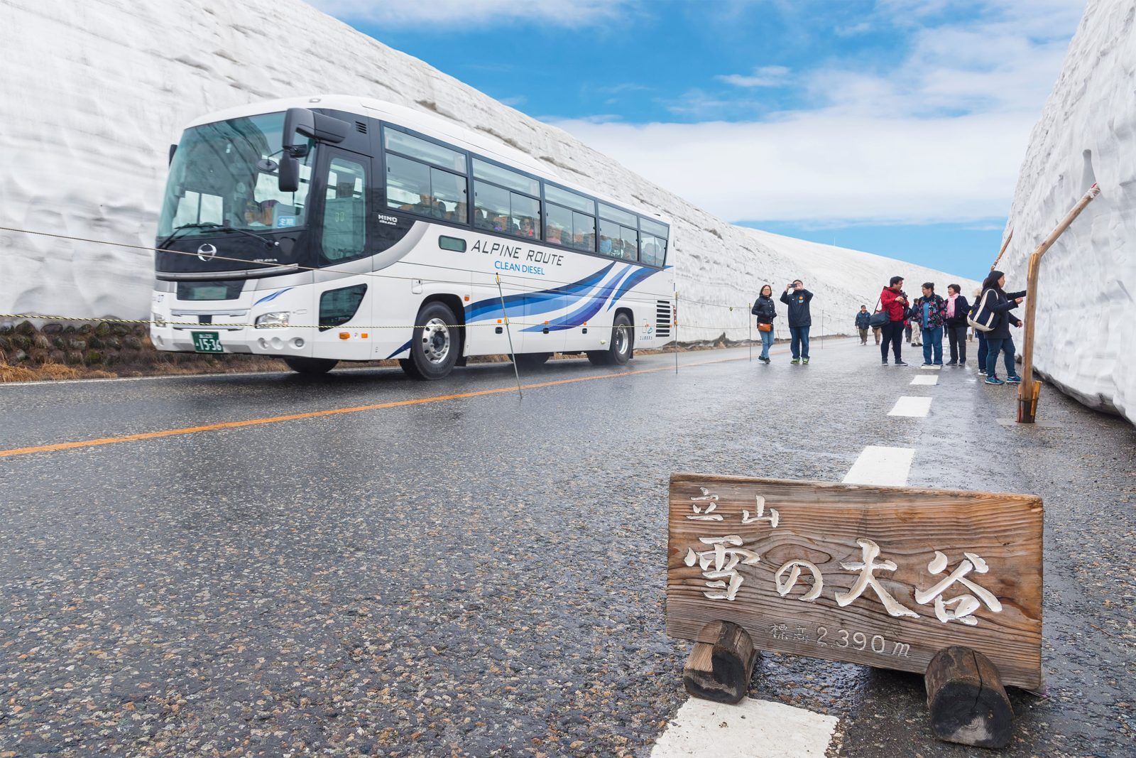 Yuki-no-Otani Snow Wall on the Tateyama Kurobe Alpine Route with a highland bus passing through