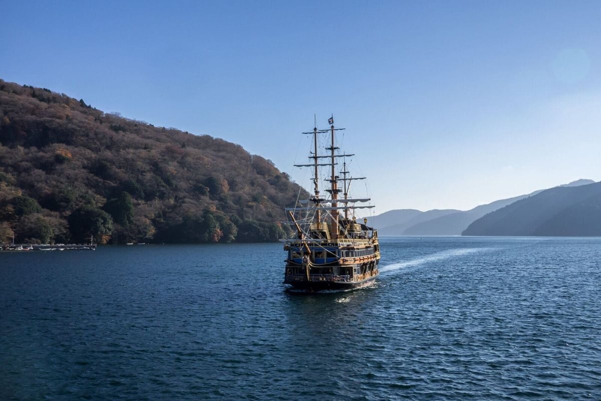 Sightseeing cruise on Lake Ashi, Hakone, with mountains behind