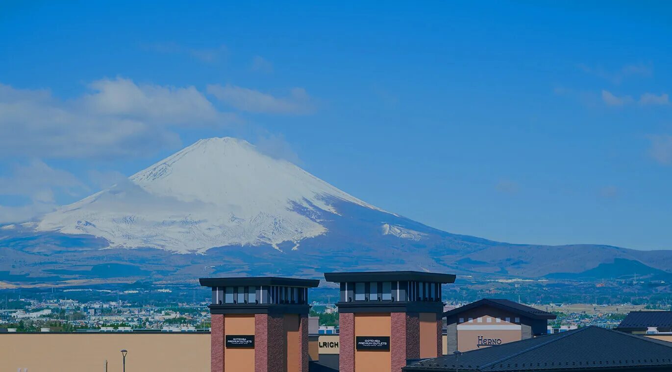 Gotemba Premium Outlets buildings with Mt. Fuji in the distance